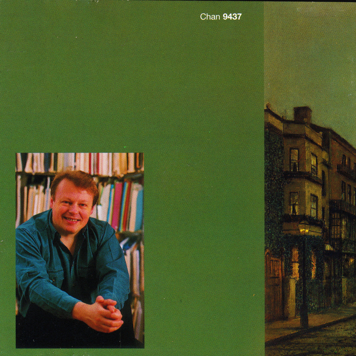 Album cover featuring a solid green background, a portrait of a smiling musician in a teal shirt on the bottom left, and a dark street scene on the right side.