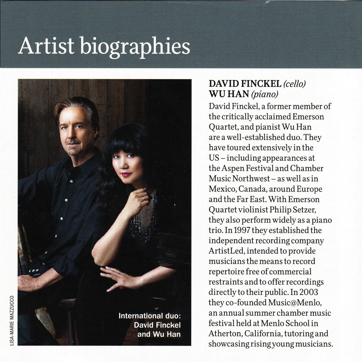 A printed artist biography page featuring a photo of cellist David Fincel and pianist Wu Han seated together, with text columns detailing their careers and collaborations.