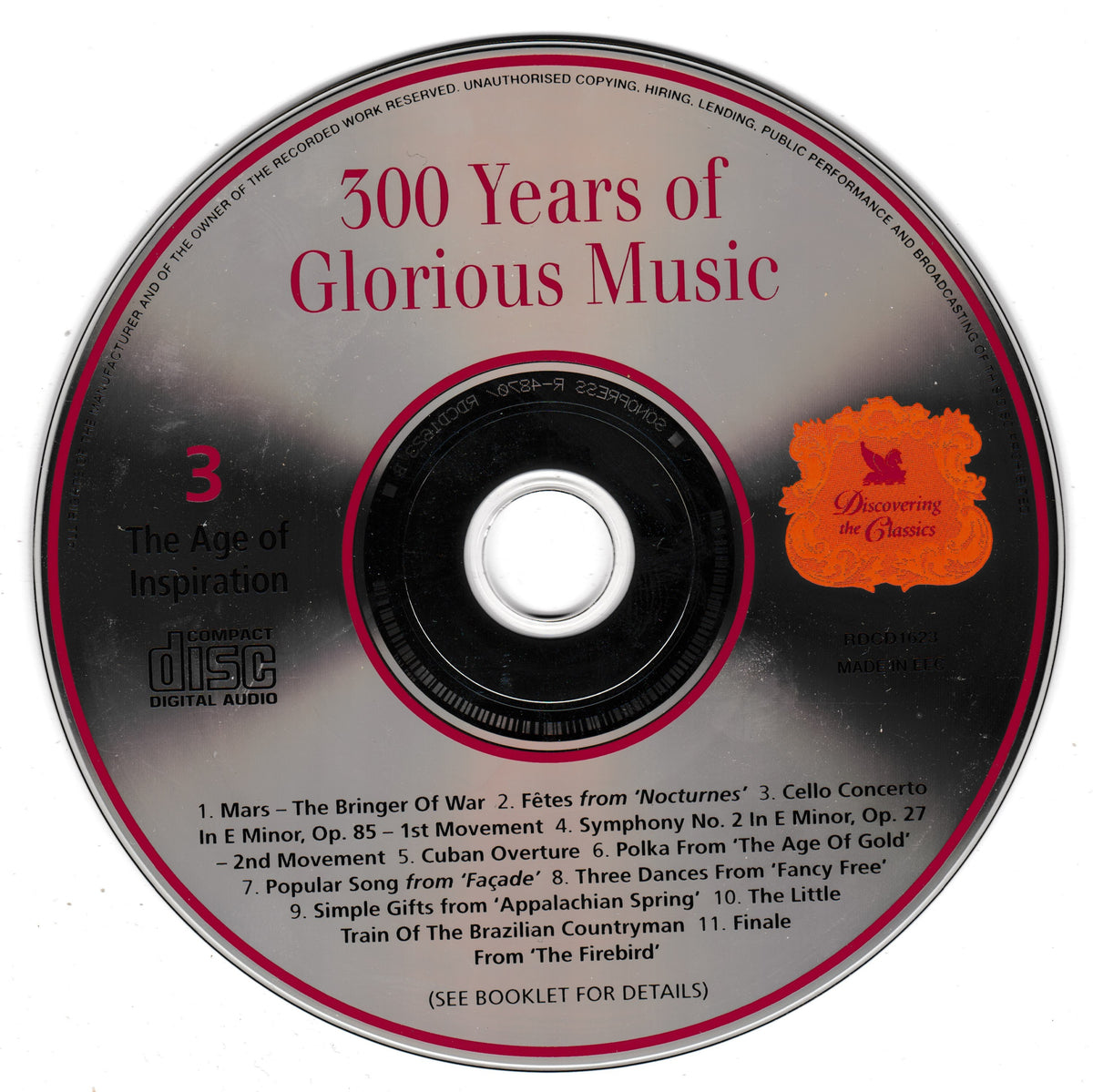 A CD disc for '300 Years of Glorious Music' featuring a black and silver design with red text, a tracklist, and an orange 'Discovering the Classics' logo.