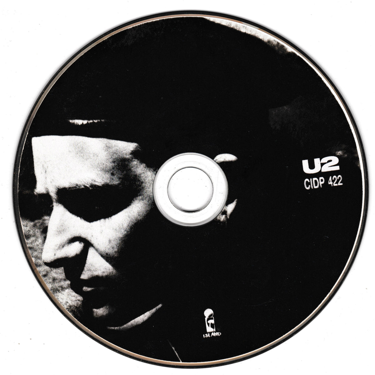 A black CD disc featuring a high-contrast black and white portrait of Bono's face, with white text reading 'U2' and 'CIDP 422' on the right side.