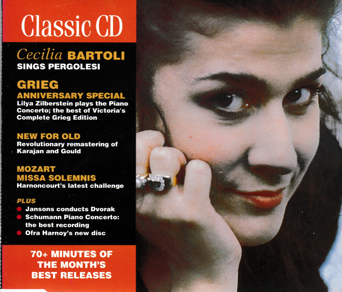 CD cover for Cecilia Bartoli's 'Grieg Anniversary Special' album, featuring a close-up portrait of the singer on the right and bold orange and black text blocks on the left with track titles including 'New for Old' and 'Mozart Missa Solemnis'.