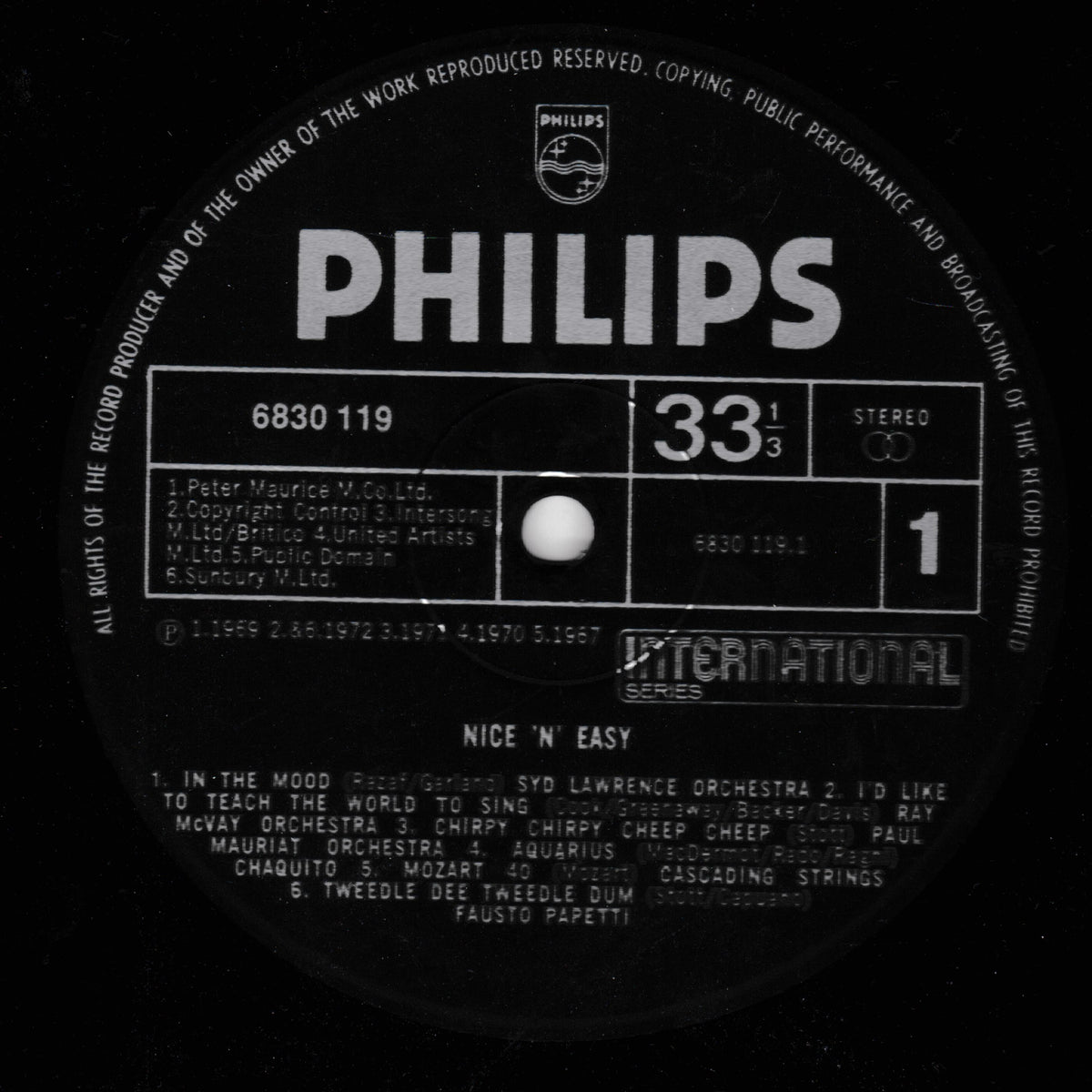 A close-up of a black vinyl record label with the Philips logo and the title 'NICE 'N EASY' by various artists, featuring catalog number 6830 119 and speed 33 1/3.