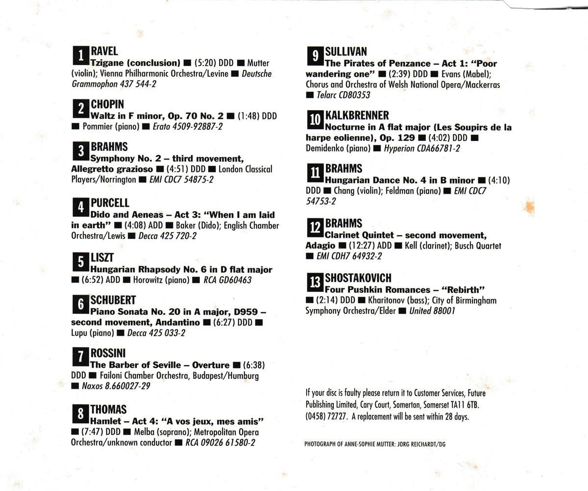 A black-and-white printed CD inlay listing classical music works with composer, instrument, duration, and orchestra names in two columns.
