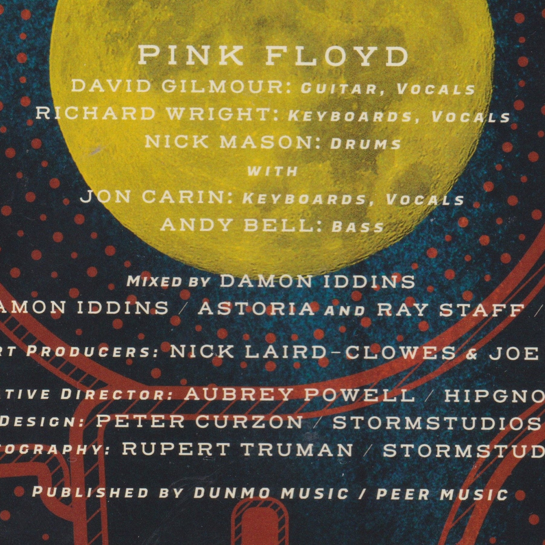 Single cover with Pink Floyd band members and production credits on a blue and yellow background