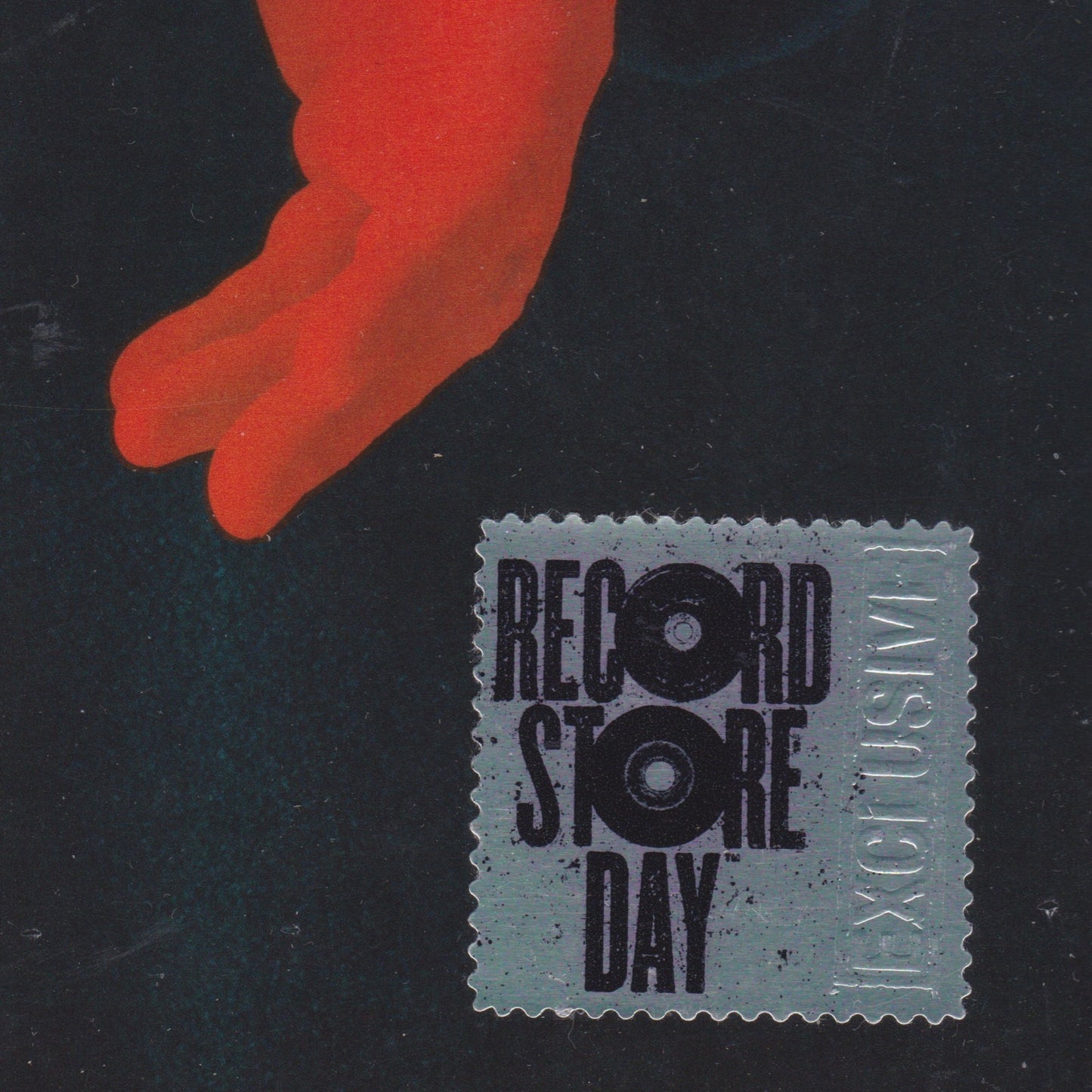 Record Store Day stamp with red hand on black background