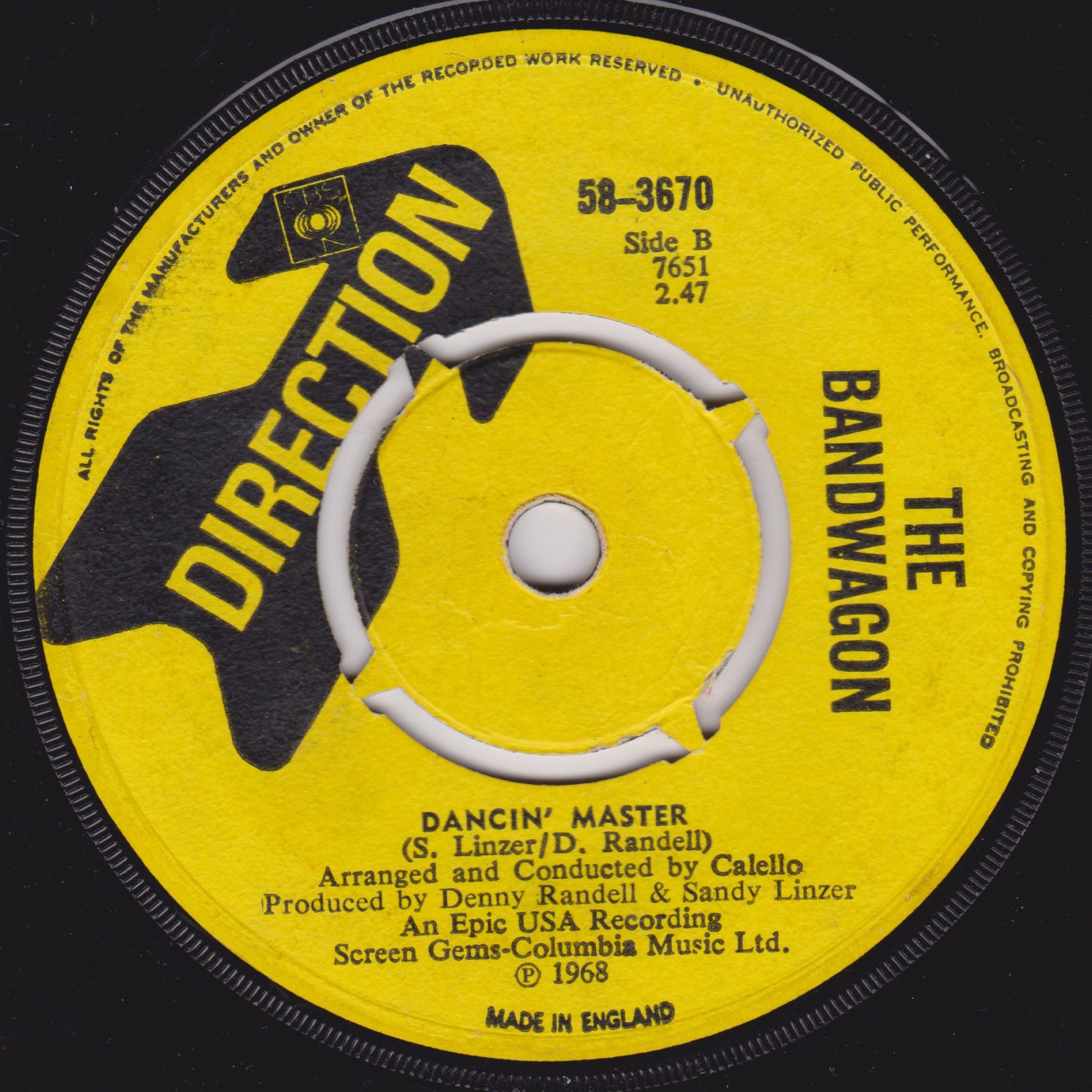 Yellow record label with black text and 'Direction' logo on a black background