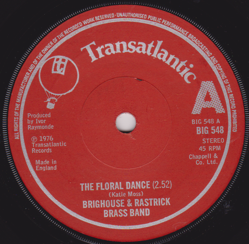 Red vinyl record label with white text and branding