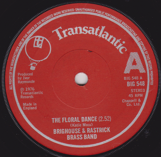 Red vinyl record label with white text and branding