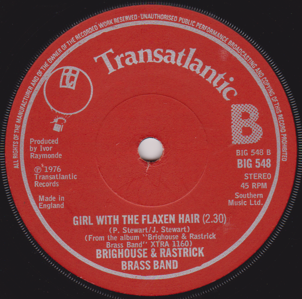 Red vinyl record label with white text and 'Transatlantic' branding