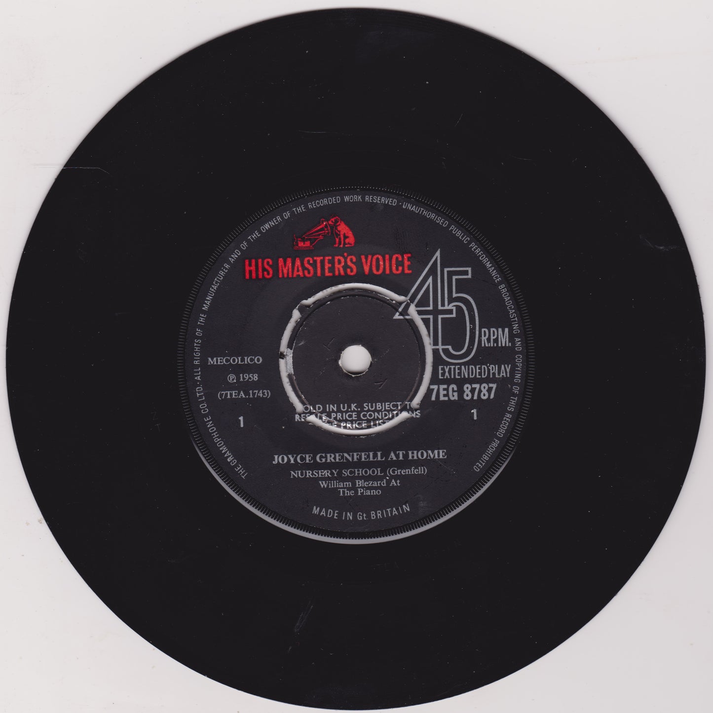 Black vinyl record with 'His Master's Voice' label on a white background