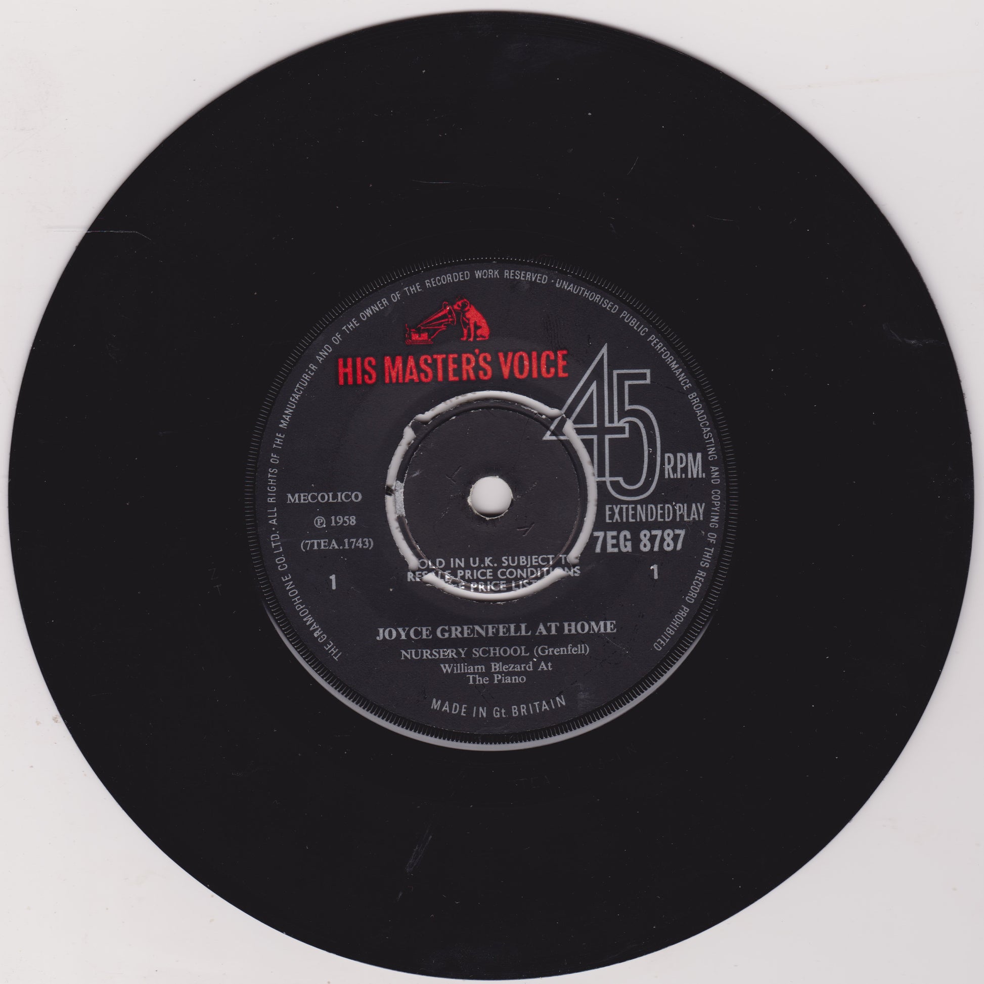 Black vinyl record with 'His Master's Voice' label on a white background
