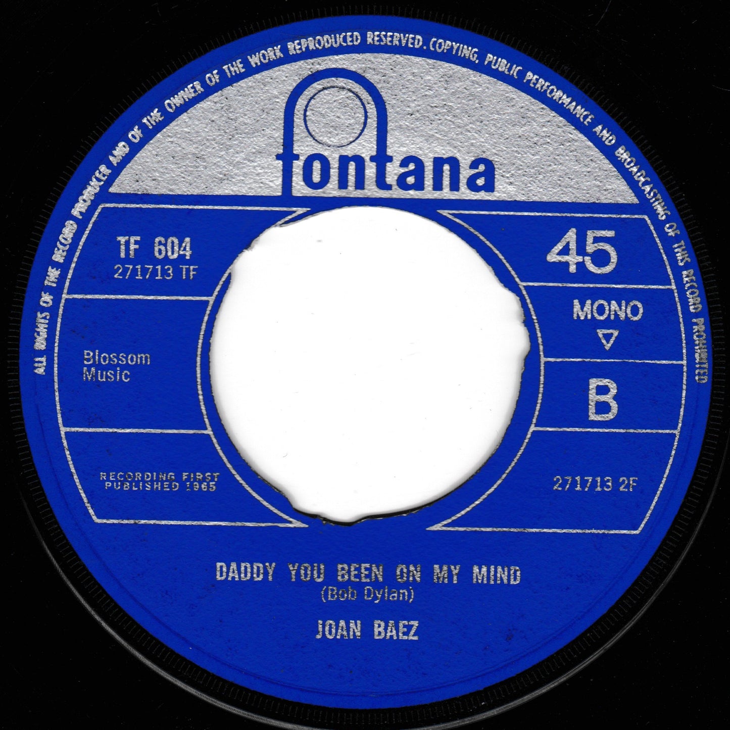 A vintage 45 rpm record label for Joan Baez's 'Daddy You Been On My Mind' on the Fontana label, featuring a blue and silver label with a white centre hole.