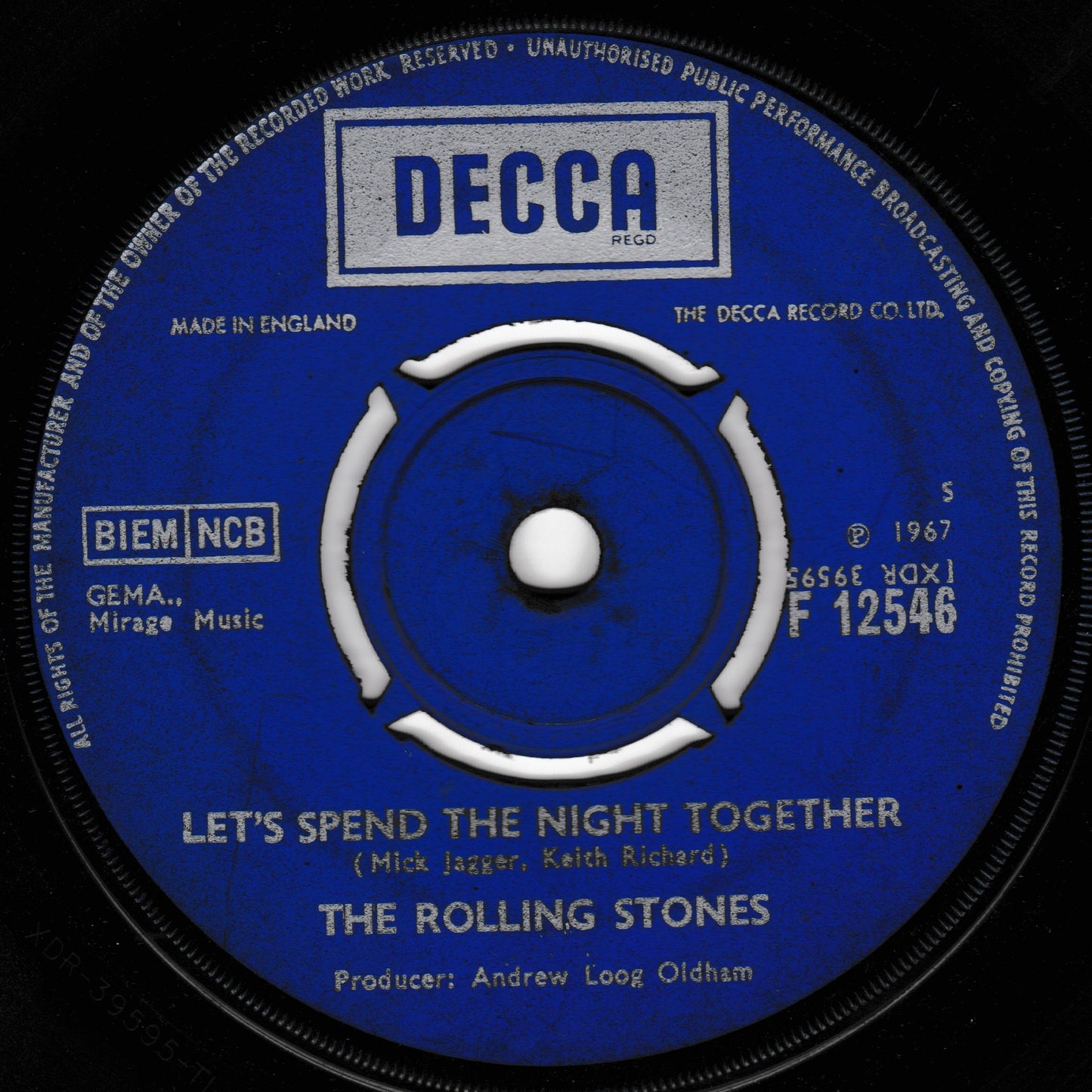 Decca label of a Rolling Stones record with 'Let's Spend the Night Together' on a black background