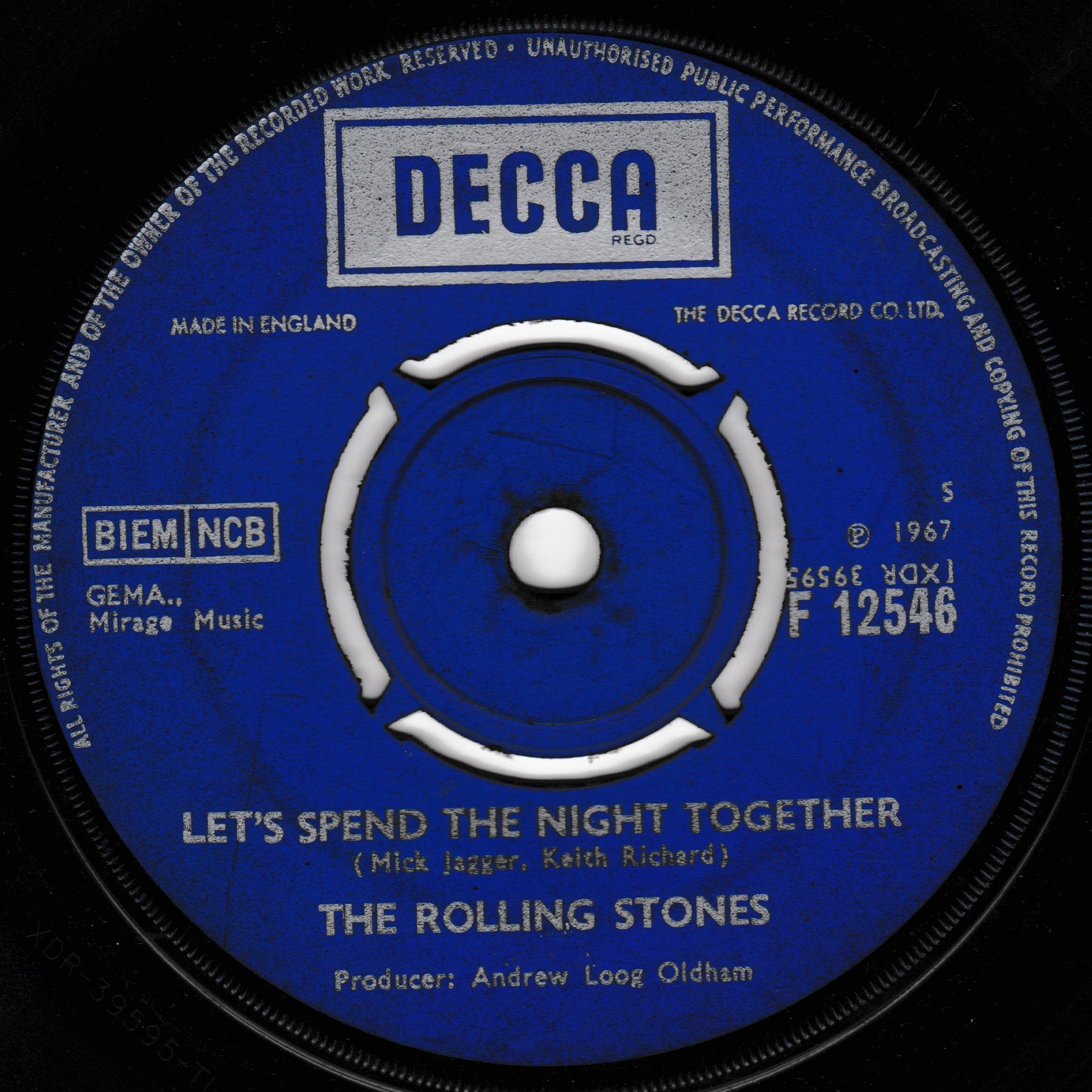 Decca label of a Rolling Stones record with 'Let's Spend the Night Together' on a black background