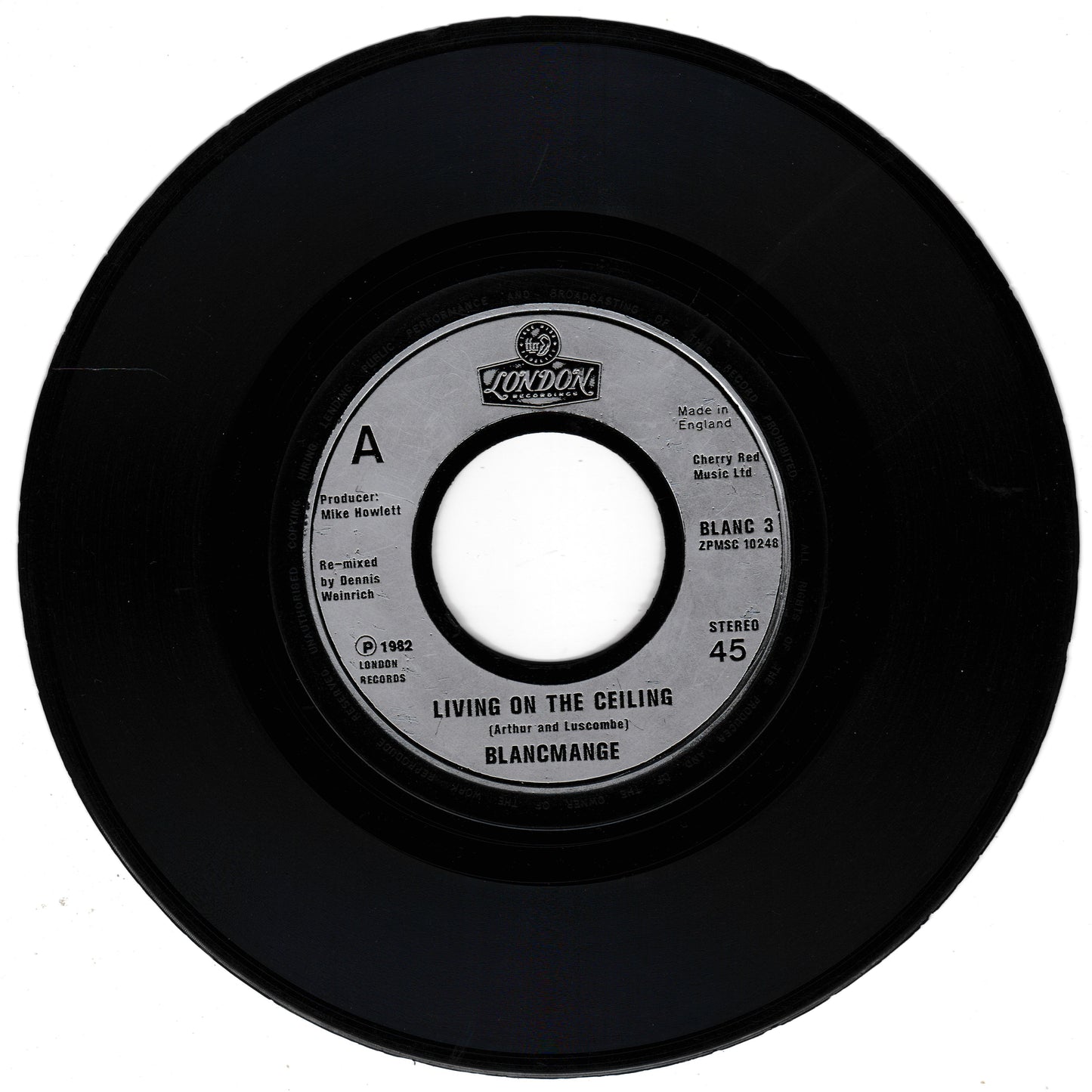 Black vinyl record with a label on a white background