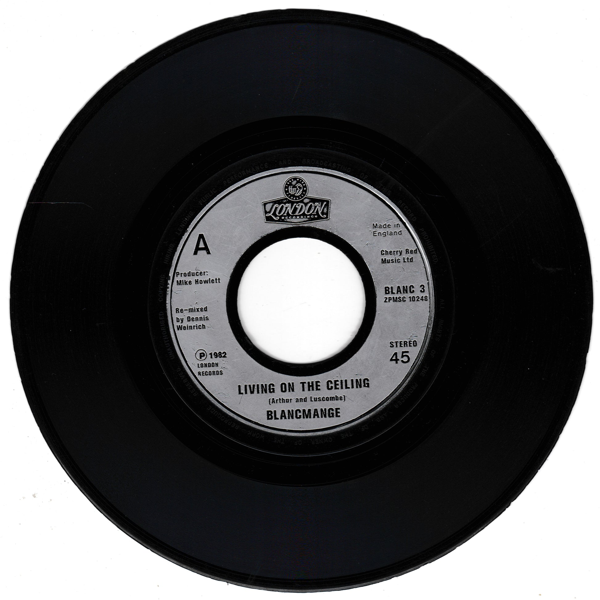 Black vinyl record with a label on a white background