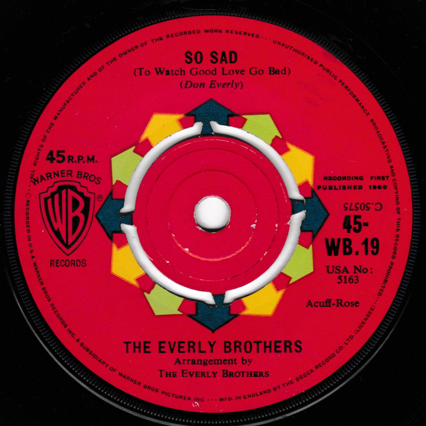 A vintage 45 RPM vinyl record label for 'So Sad' by The Everly Brothers, featuring a bright red centre label with yellow and green geometric accents and the Warner Bros. Records logo.