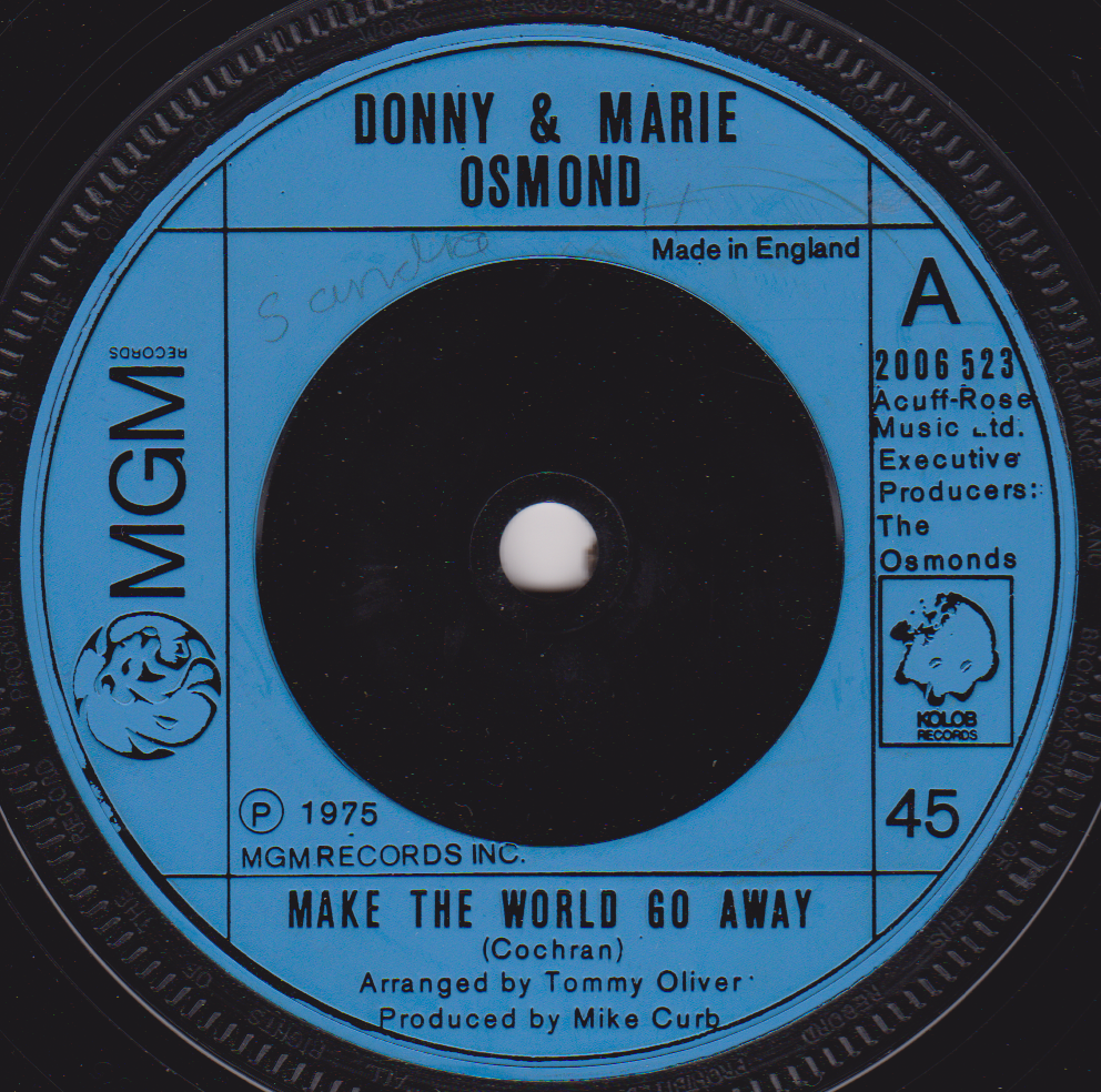 Record label for Donny & Marie Osmond's 'Make the World Go Away' with MGM logo.