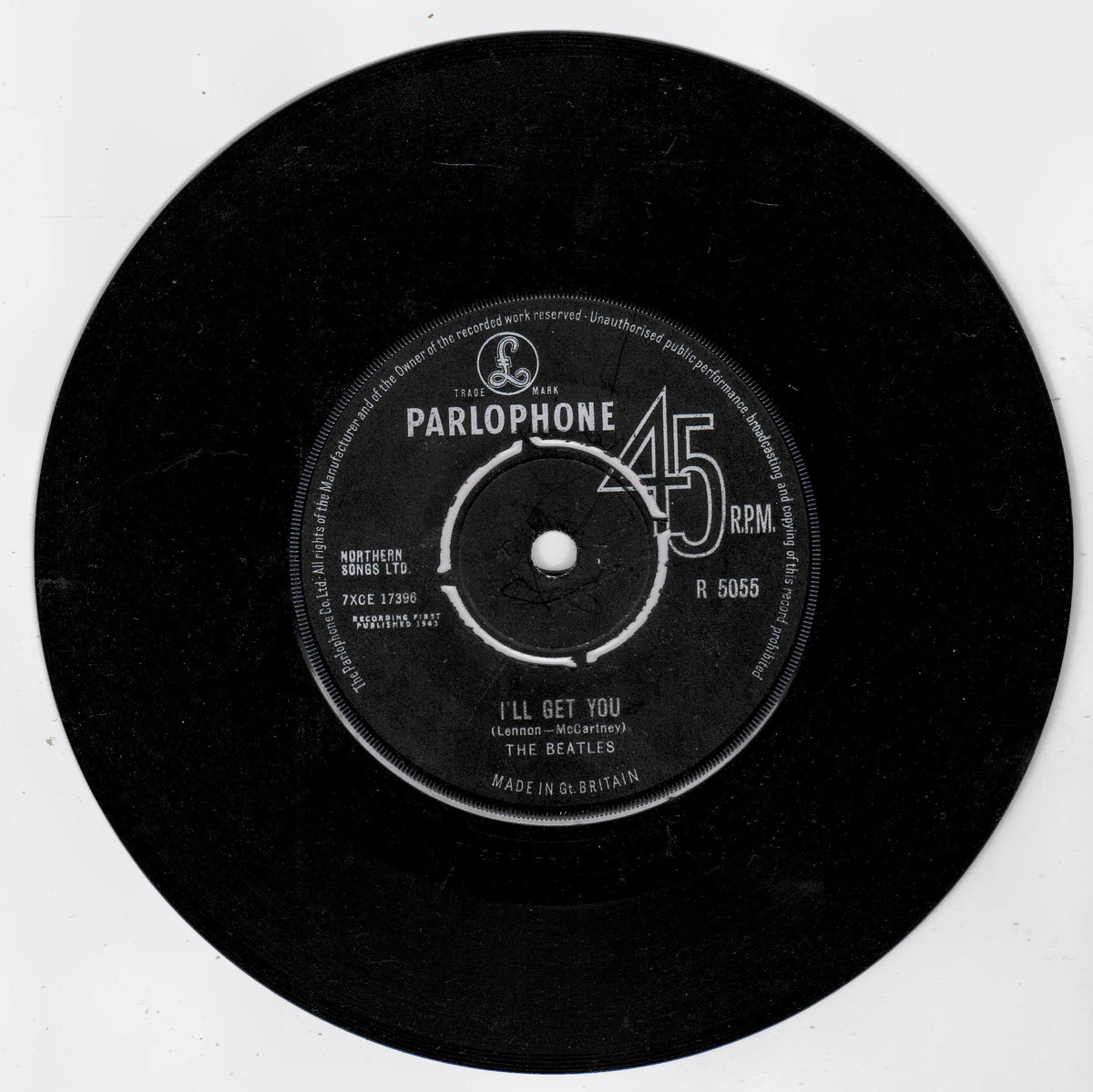 A black 45 RPM vinyl record label for The Beatles' 'I'll Get You' on Parlophone, photographed against a plain white background.