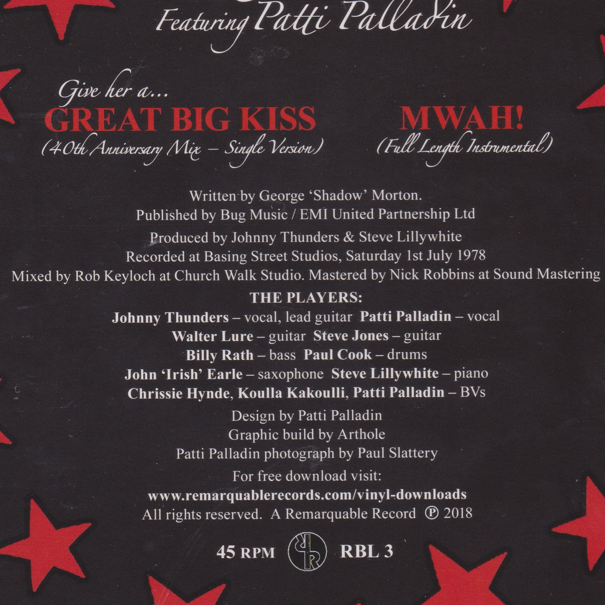 Back cover of a music single with text and red star patterns on a black background