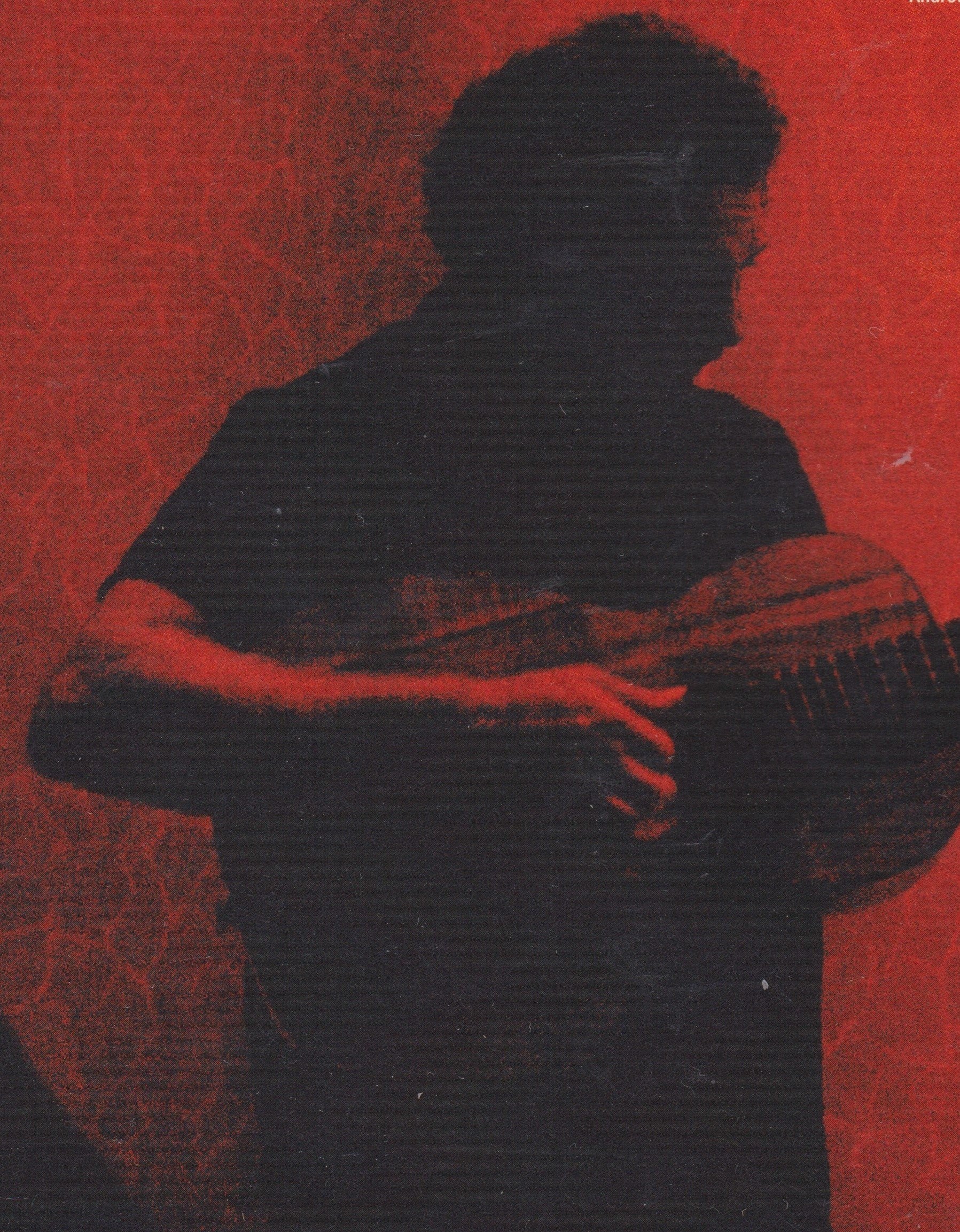 Silhouette of a person holding a guitar against a red textured background